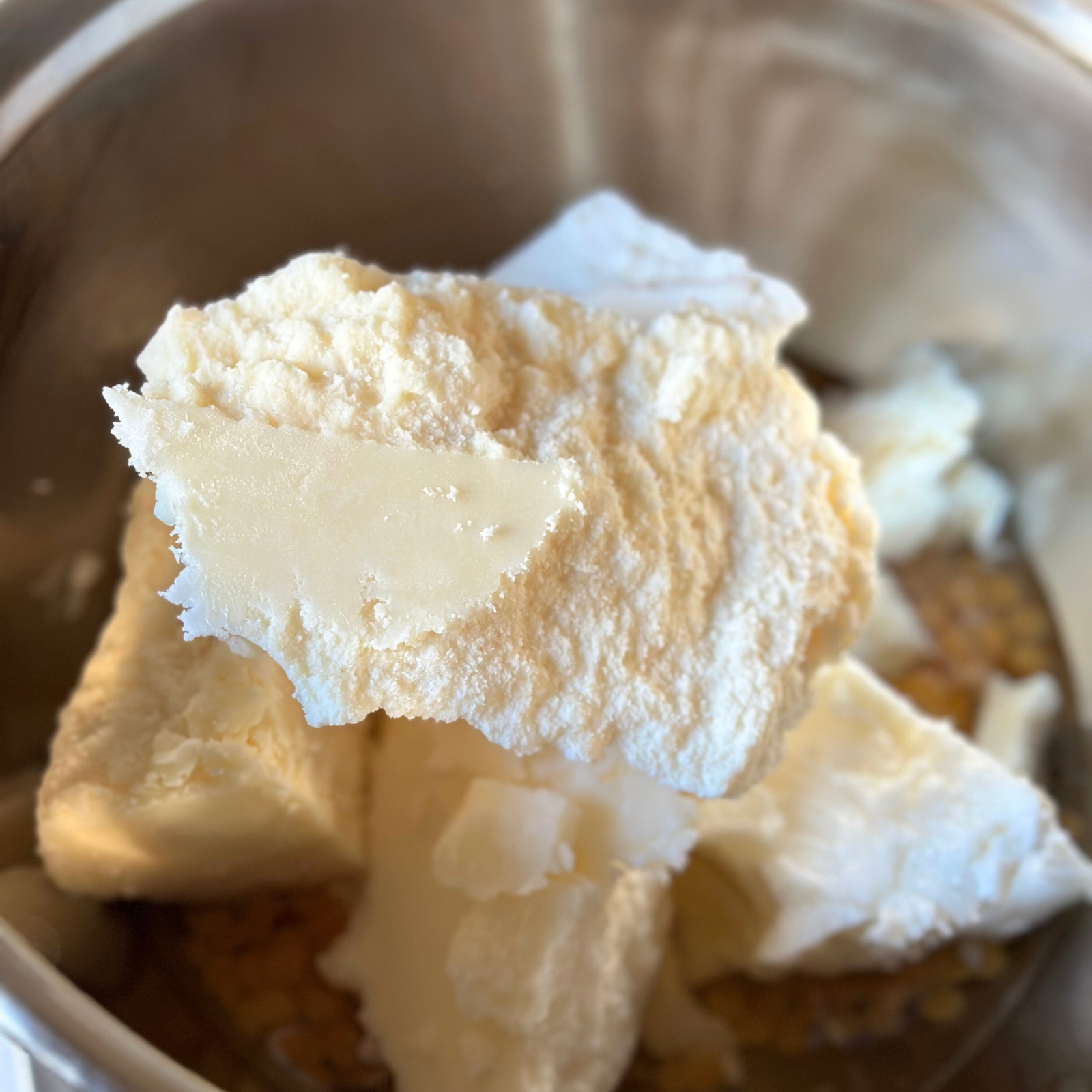 Natural plant butters being prepared for handmade CONCHUS skincare, showing raw vegan ingredients.